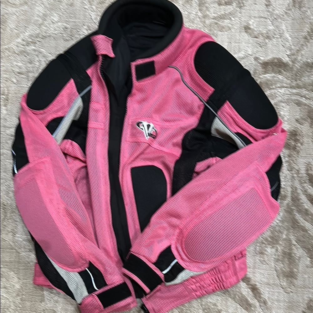 Pink and black Vega motorcycle jacket.  Adjustable wrists, neck. Good condition.